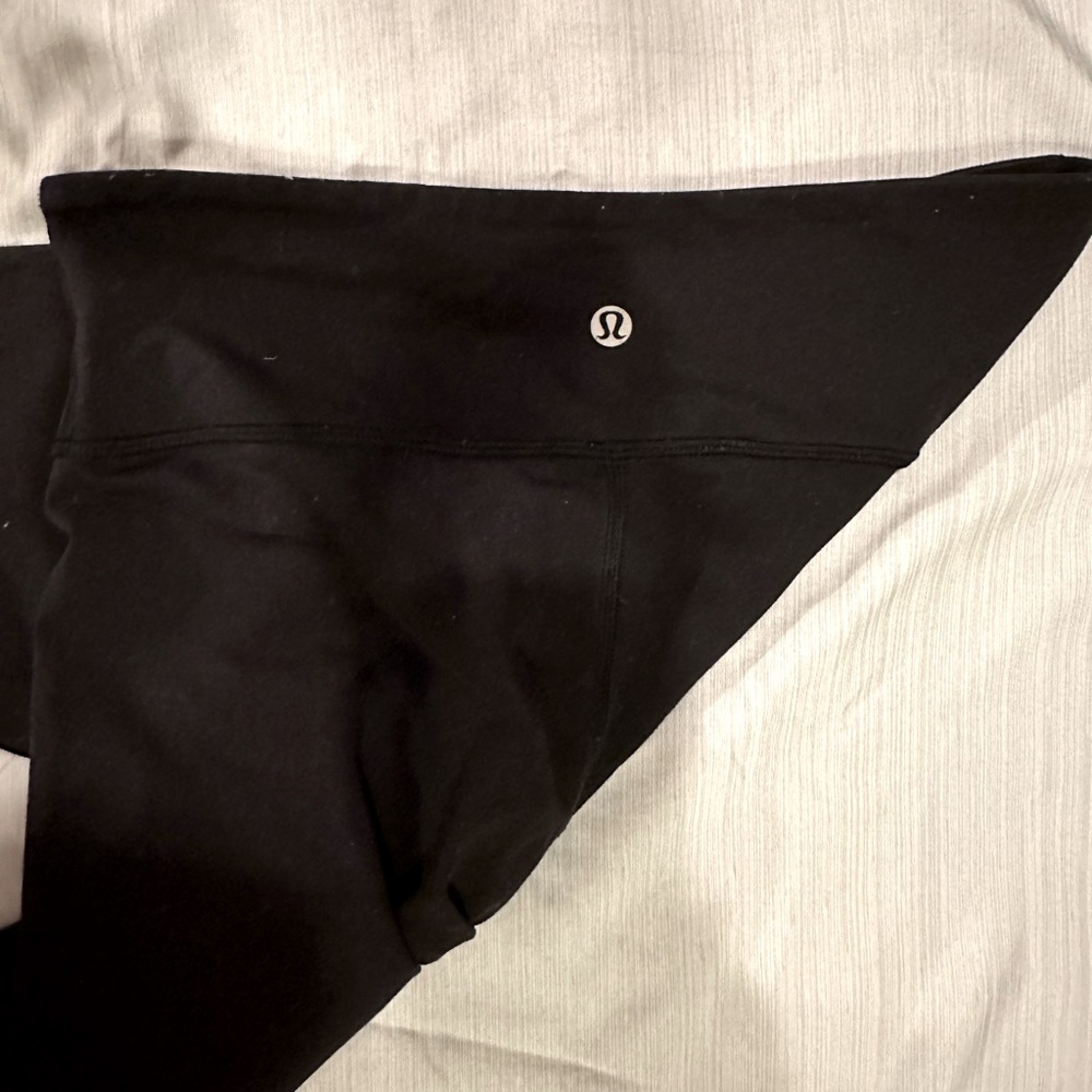 Black Lulu Legging Size four, worn once, no stains and lulu symbol in-tacked